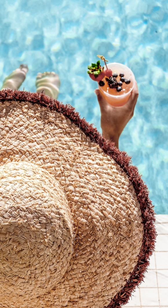 Sun loungers and parasols on the pool terrace at Harbour Hotel